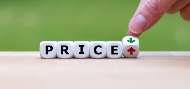 Hand is turning a dice and changes the direction of an arrow symbolizing that the price is going down (or vice versa) Hand is turning a dice and changes the direction of an arrow symbolizing that the price is going down (or vice versa) Affordable Pricing: stock pictures, royalty-free photos & images