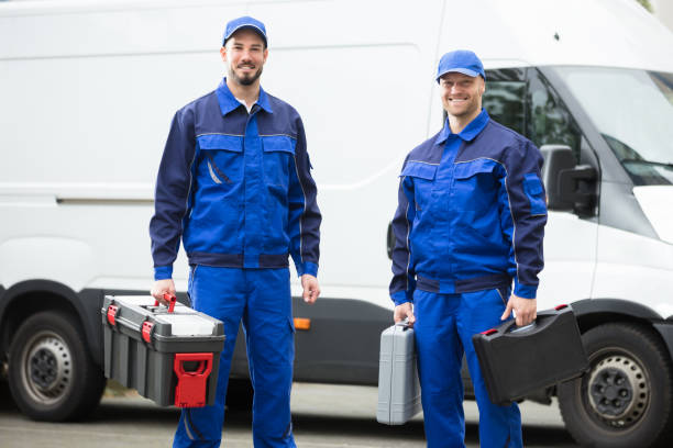 Happy Male Workers Holding Toolboxes Portrait Of A Happy Young Male Worker Holding Toolbox plumbing team stock pictures, royalty-free photos & images
