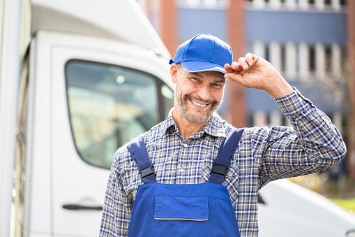 https://media.istockphoto.com/id/1316933083/photo/happy-technician-service-in-overall-near-van.jpg?b=1&s=170667a&w=0&k=20&c=iOLqGqX3_4lJaK226wCuo5iD9Pf8s33bL7FHbOtw808=