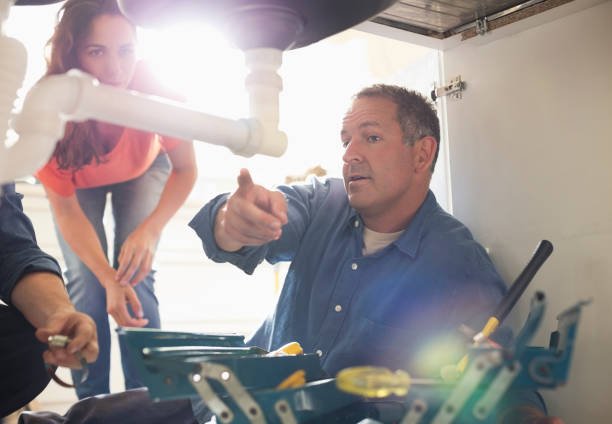 https://media.istockphoto.com/id/169270269/photo/plumbers-working-on-pipes-under-sink.jpg?b=1&s=612x612&w=0&k=20&c=UidWE6A4sHOGhOcgjriqjU9ht6ZvxPN_tlDZh5HGnYQ=