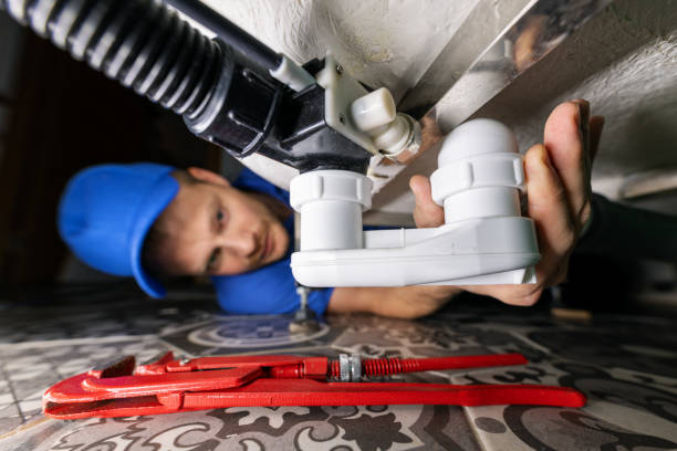 plumbing service. plumber at work in bathroom. repair and install drain siphon under the bath plumbing service. plumber at work in bathroom. repair and install drain siphon under the bath plumber stock pictures, royalty-free photos & images