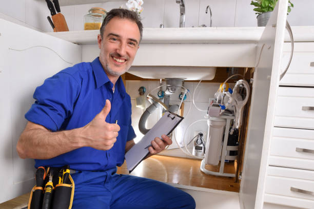 Plumbing technician checking water installation with notepad ok gesture Plumbing technician checking water installation under the sink of a home kitchen with notepad and hand with ok gesture. Horizontal composition. plumbing stock pictures, royalty-free photos & images