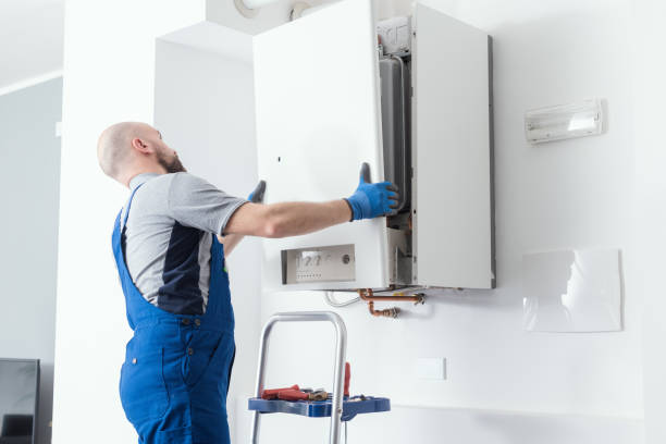 Professional boiler service at home Professional engineer doing a boiler inspection at home water heater stock pictures, royalty-free photos & images